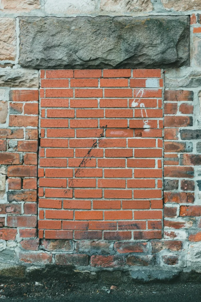 stone wall drawing references window closed with red bricks